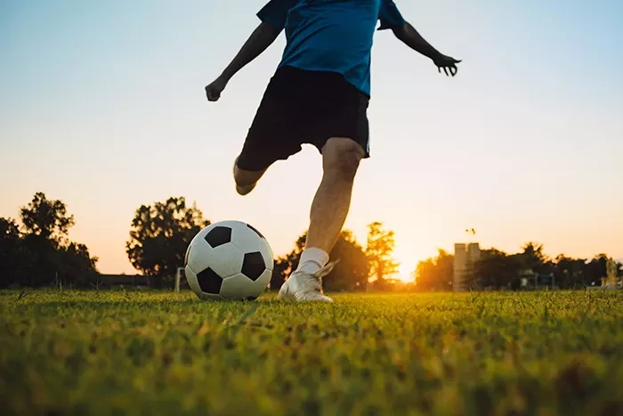 boy-kicking-soccer-ball