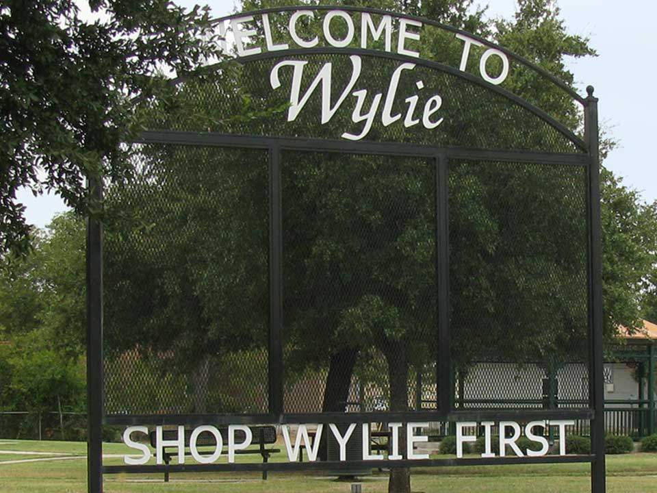 Welcome to Wylie shopping sign in downtown Wylie