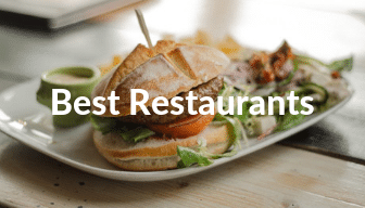 Food served on white plate, hamburger at restaurant