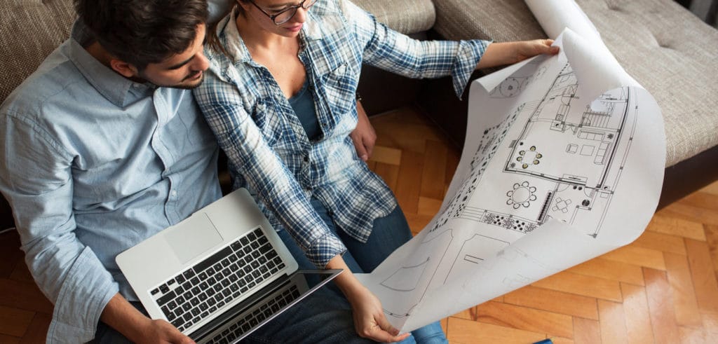couple looking at home blueprints
