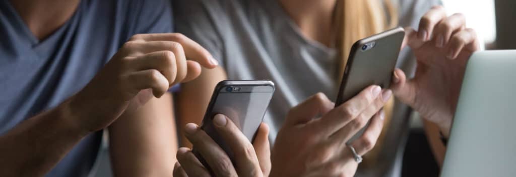 couple using smartphones