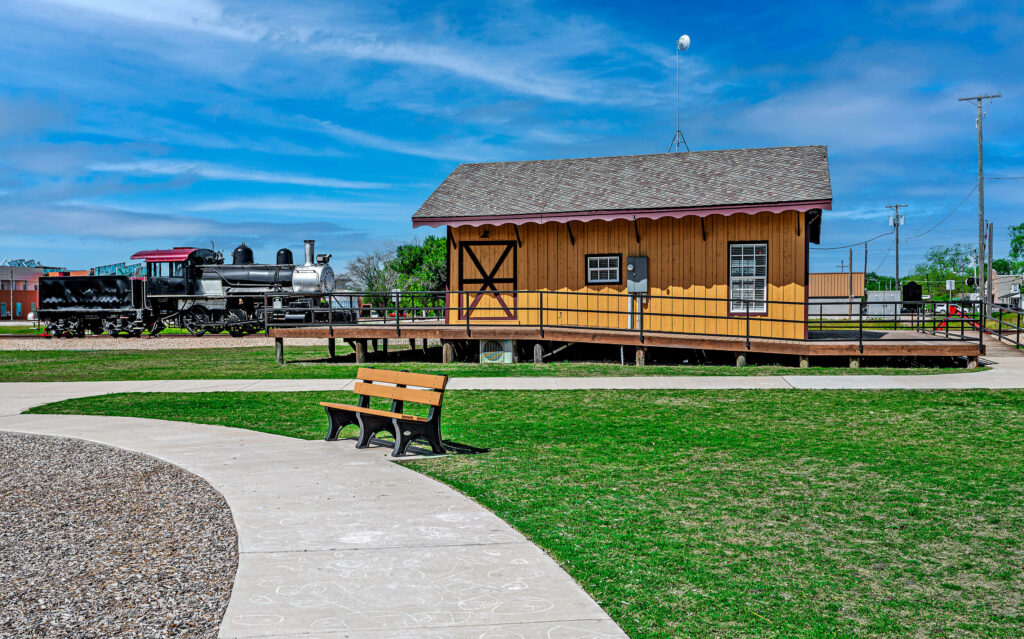 Park bench at Train depot Houston and Texas Central Railway in Anna TX