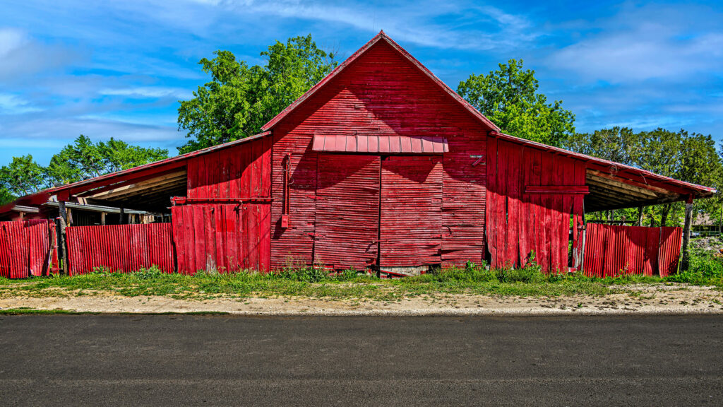 Red barn attached to hardware store in Anna TX