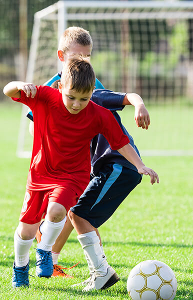 Kids on a soccer field in Plano