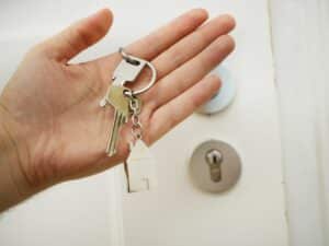 Man holding new house keys