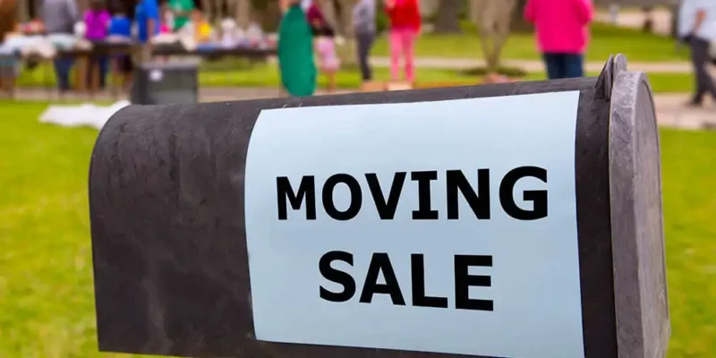 Moving Sale sign on the side of a mailbox
